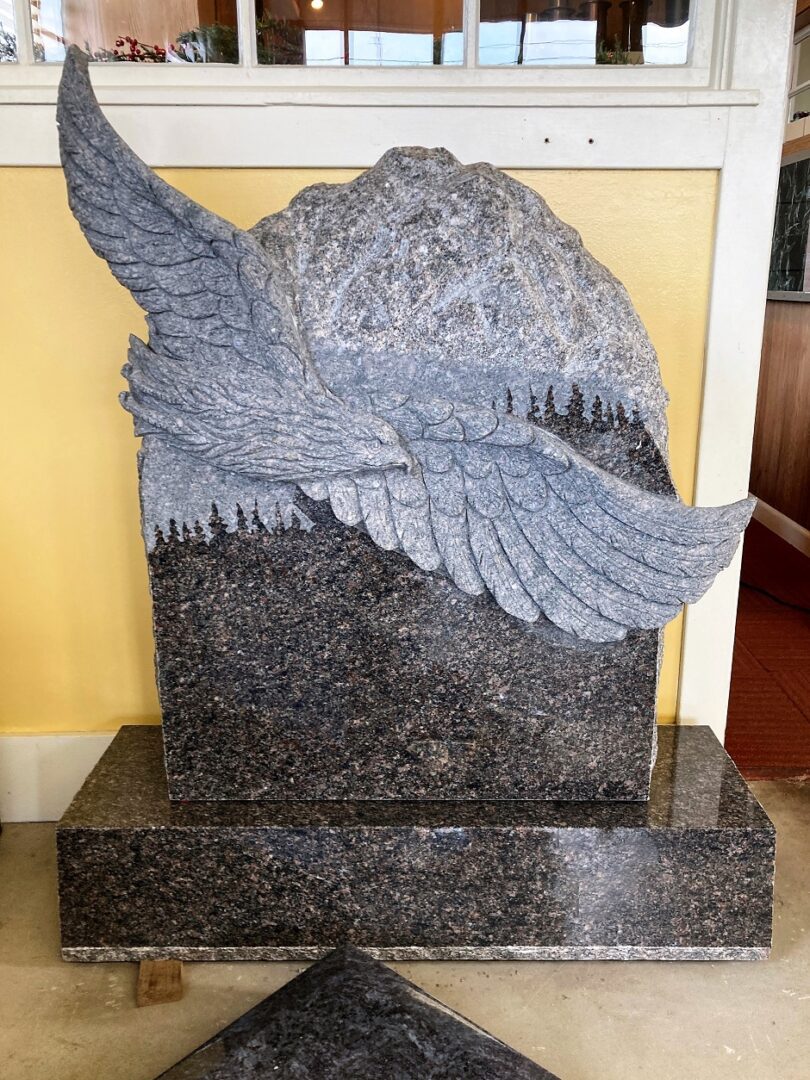 A tombstone with an eagle