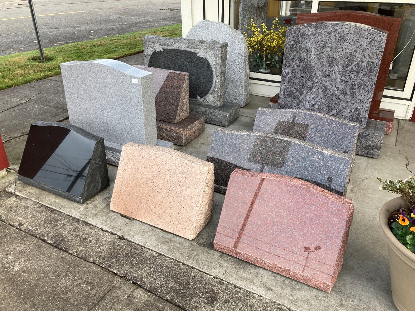 Different kinds of granite headstones near the street